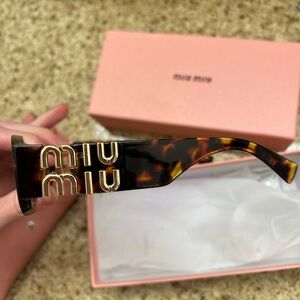 Miu Miu Tortoise Shell Sunglasses with Gold Logo